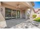 Covered back patio with tile floor, ceiling fan, and views of the backyard at 2409 W Red Range Way, Phoenix, AZ 85085