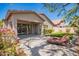 Charming backyard with desert landscaping, covered patio, and stone pavers at 2409 W Red Range Way, Phoenix, AZ 85085