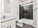 Modern bathroom featuring black tiled shower and granite countertop sink at 2409 W Red Range Way, Phoenix, AZ 85085