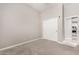 Bedroom with gray carpet and closet in a house for sale at 2409 W Red Range Way, Phoenix, AZ 85085