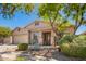 Charming single-story home featuring desert landscaping, a covered entry, and attached two car garage at 2409 W Red Range Way, Phoenix, AZ 85085