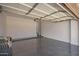 Spacious two car garage with epoxy floor, automatic door and white painted walls at 2409 W Red Range Way, Phoenix, AZ 85085