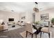 Open living and dining area with modern lighting, neutral palette, and stylish decor perfect for entertaining at 2409 W Red Range Way, Phoenix, AZ 85085