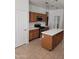 The kitchen is well-appointed with modern appliances, custom cabinetry, and a functional center island at 26022 N Sandstone Way, Surprise, AZ 85387