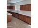 Bright kitchen featuring plentiful counter space, oak cabinets, and stainless steel appliances at 26022 N Sandstone Way, Surprise, AZ 85387