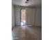 Bright living room featuring tile floors and sliding glass doors leading to the outdoor space at 26022 N Sandstone Way, Surprise, AZ 85387