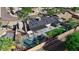 Aerial view of a property showcasing a pool, grassy backyard, solar panels, and covered patio at 2656 N 84Th Pl, Scottsdale, AZ 85257