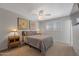 Relaxing bedroom with neutral colors, ceiling fan, and plantation shutters for comfortable light at 2656 N 84Th Pl, Scottsdale, AZ 85257