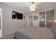 Bedroom with a ceiling fan, a closet, and a door to another room at 2656 N 84Th Pl, Scottsdale, AZ 85257