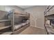 Bedroom featuring bunk beds with a tree mural on the wall at 2656 N 84Th Pl, Scottsdale, AZ 85257