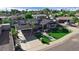 Charming home featuring a covered carport, desert landscaping, and solar panels for energy efficiency at 2656 N 84Th Pl, Scottsdale, AZ 85257