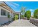 Front view showing a paved driveway and tasteful landscaping surrounding the home's entrance at 2656 N 84Th Pl, Scottsdale, AZ 85257