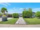 Beautifully landscaped front yard with a unique stone pathway leading to the inviting home at 2656 N 84Th Pl, Scottsdale, AZ 85257