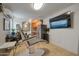Comfortable living room with tiled floors, a modern dental chair, and a view into the kitchen at 2656 N 84Th Pl, Scottsdale, AZ 85257
