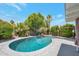 Backyard pool surrounded by lush greenery, offering a private outdoor retreat at 2656 N 84Th Pl, Scottsdale, AZ 85257