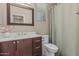 This bathroom includes a single vanity with a dark wood finish, a toilet, and a shower and tub combo at 3349 E Merlot St, Gilbert, AZ 85298