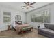 Calming bedroom with large windows, ceiling fan, and comfortable furnishings at 3349 E Merlot St, Gilbert, AZ 85298