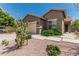 Charming single-story home featuring a two-car garage, secure door, and desert landscaping at 3349 E Merlot St, Gilbert, AZ 85298