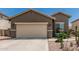 Charming single-story home featuring a two-car garage with desert landscaping in a sunny neighborhood at 3349 E Merlot St, Gilbert, AZ 85298