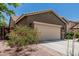 Charming single-story home featuring a two-car garage and colorful desert landscaping at 3349 E Merlot St, Gilbert, AZ 85298