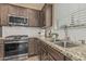 Modern kitchen showcasing updated appliances and stylish countertops at 3349 E Merlot St, Gilbert, AZ 85298
