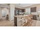 Granite-topped island with seating enhances this kitchen's function and beauty at 3349 E Merlot St, Gilbert, AZ 85298