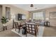 Bright living room featuring neutral tones, a large TV, comfortable seating, and stylish décor at 3349 E Merlot St, Gilbert, AZ 85298