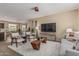 Cozy living room showcasing plush seating, contemporary decor, and seamless flow to dining at 3349 E Merlot St, Gilbert, AZ 85298