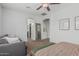 This spacious main bedroom boasts neutral tones, a ceiling fan, and convenient access to the ensuite bathroom and walk-in closet at 3349 E Merlot St, Gilbert, AZ 85298