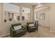 View of a comfy sitting area with verdant chairs, enhancing the home's serene ambiance at 3349 E Merlot St, Gilbert, AZ 85298