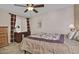 Bedroom featuring natural light from the windows, a ceiling fan, and wooden furniture at 3510 E Hampton Ave # 74, Mesa, AZ 85204
