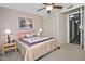 Bedroom with an accent painting, ceiling fan and doorway that leads to the hall at 3510 E Hampton Ave # 74, Mesa, AZ 85204
