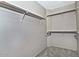 Walk-in closet with white shelves and rods at 3510 E Hampton Ave # 74, Mesa, AZ 85204