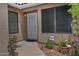 Welcoming front entrance with security door and desert-friendly landscaping at 3510 E Hampton Ave # 74, Mesa, AZ 85204