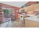 Charming kitchen with tile floors, white appliances, and sliding door to the patio at 3510 E Hampton Ave # 74, Mesa, AZ 85204