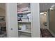 Neatly organized linen closet with shelves stocked with an assortment of towels at 3510 E Hampton Ave # 74, Mesa, AZ 85204