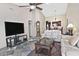 Spacious living room featuring vaulted ceilings, ceiling fan and slate flooring throughout at 3510 E Hampton Ave # 74, Mesa, AZ 85204