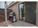 Covered patio with a barbecue grill, a sliding glass door, and brick accents for outdoor entertaining at 3510 E Hampton Ave # 74, Mesa, AZ 85204