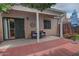 Private covered patio with red pavers perfect for outdoor relaxation at 3510 E Hampton Ave # 74, Mesa, AZ 85204