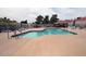 Community pool area with seating, tables, and umbrellas, providing a perfect spot for relaxation and socializing at 3510 E Hampton Ave # 74, Mesa, AZ 85204