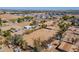 Expansive aerial view showcasing the property's large lot and equestrian facilities in a serene desert community at 3738 E Hash Knife Draw Rd, Queen Creek, AZ 85140