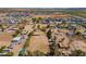 Aerial view highlights property's spacious lot with equestrian potential amidst a peaceful desert neighborhood at 3738 E Hash Knife Draw Rd, Queen Creek, AZ 85140