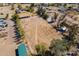 Scenic aerial view of the property featuring multiple outbuildings, horse facilities, and wide open spaces at 3738 E Hash Knife Draw Rd, Queen Creek, AZ 85140
