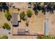 Overhead perspective of the property highlighting the homes, horse areas, and lush landscaping at 3738 E Hash Knife Draw Rd, Queen Creek, AZ 85140