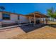 Backyard featuring a covered patio and accessibility ramp at 3738 E Hash Knife Draw Rd, Queen Creek, AZ 85140