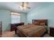 Cozy bedroom with a bed and desk in front of a window at 3738 E Hash Knife Draw Rd, Queen Creek, AZ 85140