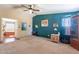 Carpeted primary bedroom featuring calming decor and an en-suite bathroom at 3738 E Hash Knife Draw Rd, Queen Creek, AZ 85140