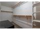 Walk-in closet with wood shelving and carpet flooring at 3738 E Hash Knife Draw Rd, Queen Creek, AZ 85140