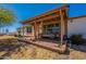 Welcoming covered front porch with charming decor and comfortable seating, perfect for relaxation at 3738 E Hash Knife Draw Rd, Queen Creek, AZ 85140