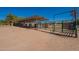 Horse paddock with metal enclosure and shelter offering plenty of room and protection for livestock at 3738 E Hash Knife Draw Rd, Queen Creek, AZ 85140